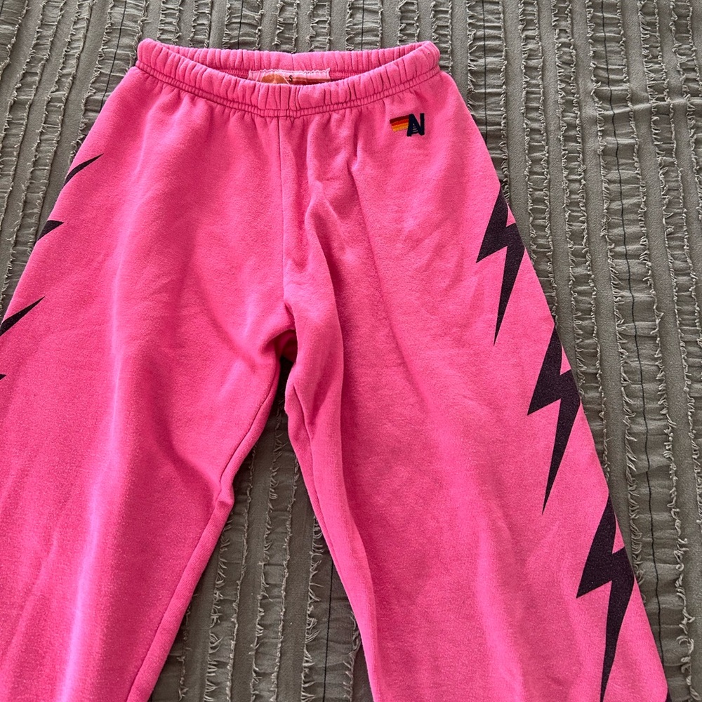 Pink Kids Joggers with Black Lightning Design